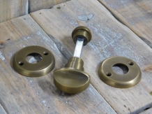 Toilet door hardware, twist lock, brass patinated