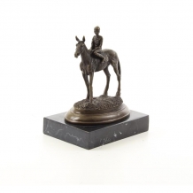 A bronze sculpture of a horse with rider