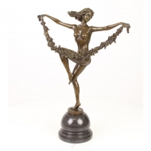 A bronze statue/sculpture of a flower dancer