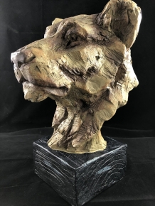 A beautiful head of a lion, beautiful in detail, polystone wood look