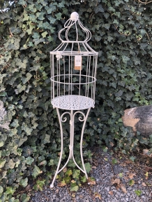 Birdcage standing on graceful wrought iron legs, a piece of jewelry!!