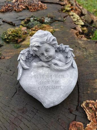 tomb statue in a heart with angel