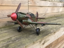 A metal scale model of a fighter plane