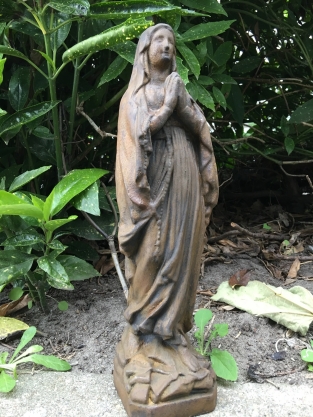 Statue of Mary full of stone, beautiful in detail, oxide color