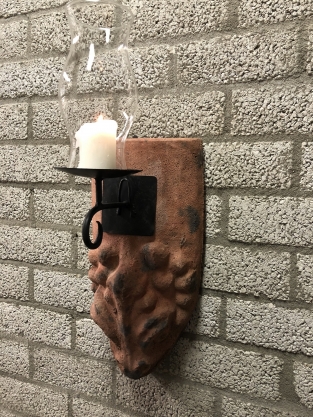 Wind light of roof tile with mythical image, with candlestick and glass flask.