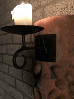 Wind light from roof tile with mythical image, with candlestick.