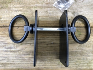 Pair off rustic large black rings as door closers/gate closers, beautifully nostalgic.