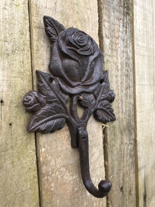 Coat rack with a rose, coat rack in cast iron, antique, brown