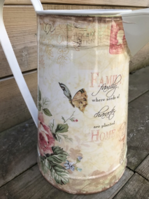 Large jug with beautiful images, made of metal