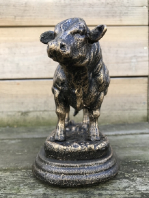 A beautiful statue of a bull, made of cast iron