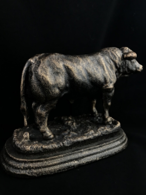 A beautiful statue of a bull, made of cast iron