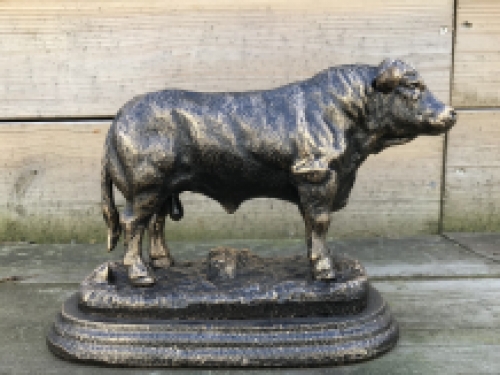 A beautiful statue of a bull, made of cast iron