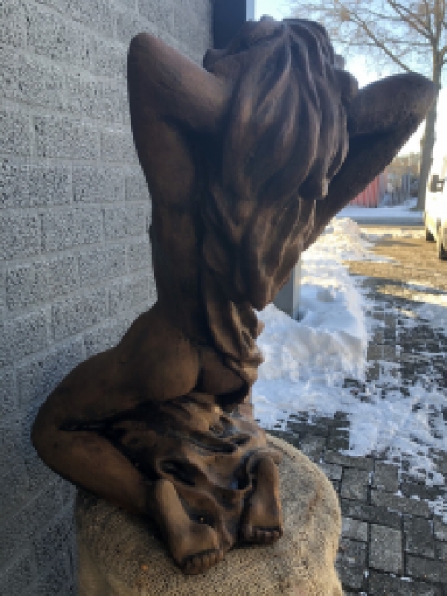 A beautiful statue of a naked woman, completely cast iron rust oxide, beautiful in detail!