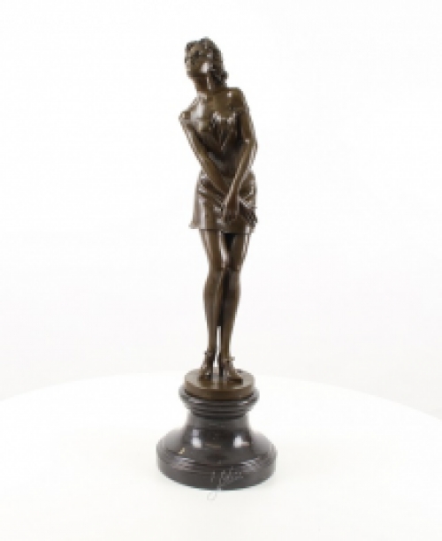 A bronze statue/sculpture of a pensive woman