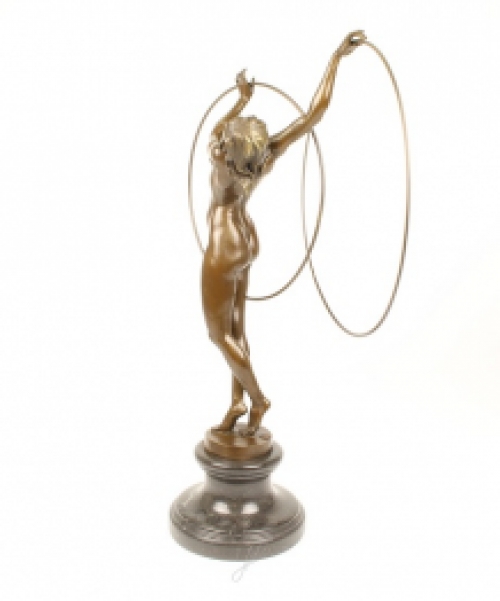 A bronze statue/sculpture of a naked hula hoop dancer