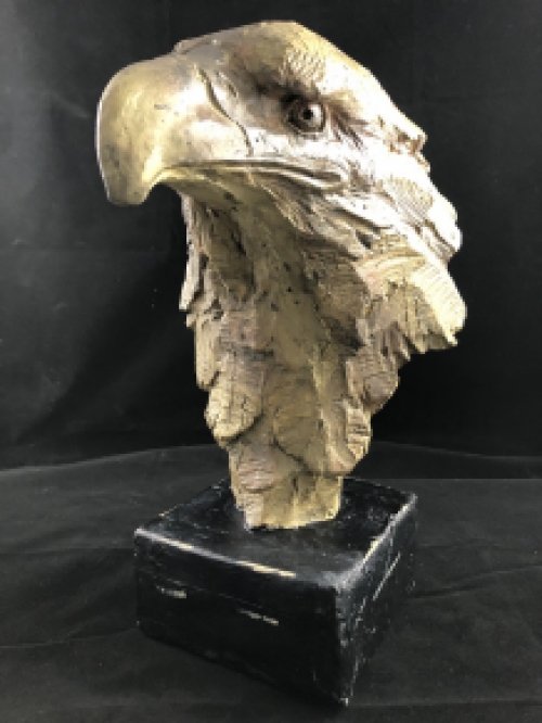 A beautiful head of an eagle, beautiful in detail, polystone wood look