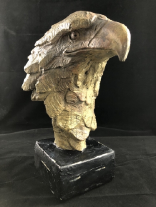 A beautiful head of an eagle, beautiful in detail, polystone wood look