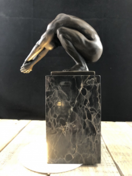 A bronze statue/sculpture of a diving man, ''THE DIVE''