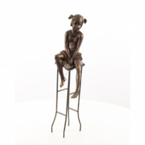 Polystone statue of a little girl on a chair.