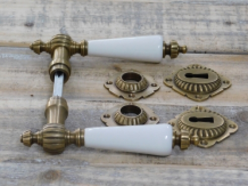 Set of door handles with rosettes - patinated brass 