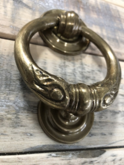 Door knocker, stylish and antique brass.