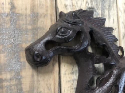 Wall ornament abstract image of a running horse, cast iron brown.