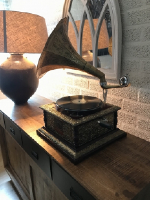 Graceful nostalgic gramophone, record player made of brass and wood