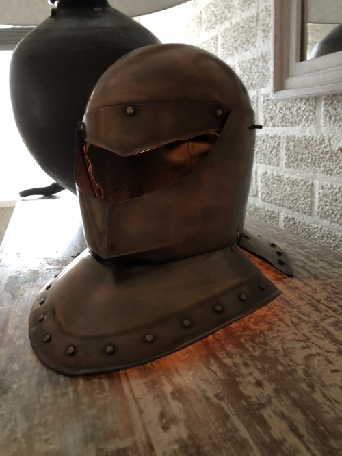 Knight's helmet copper, with folding visor.