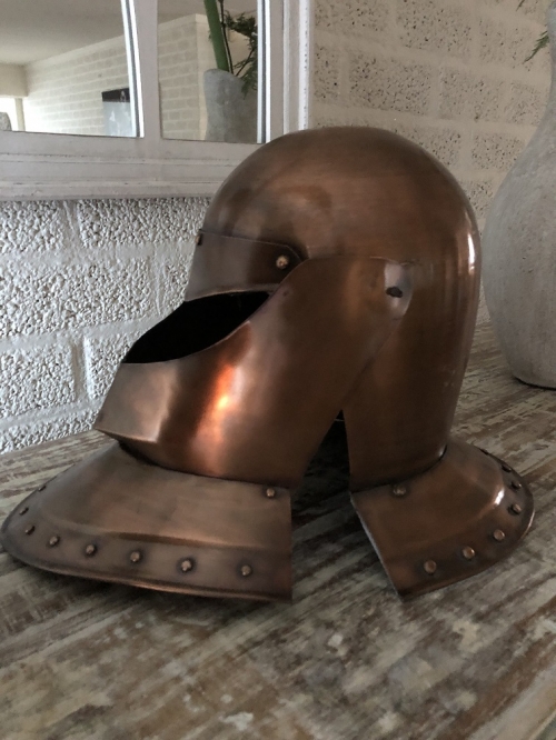 Knight's helmet copper, with folding visor.