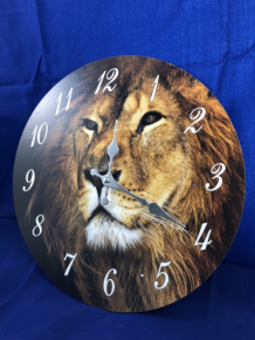 Wooden clock with image of a lion.