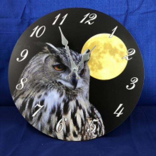 Wooden clock with an image of an owl