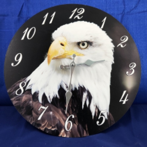 Wooden clock with an image of an eagle.