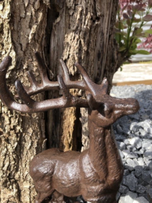Beautiful cast iron deer on stand.