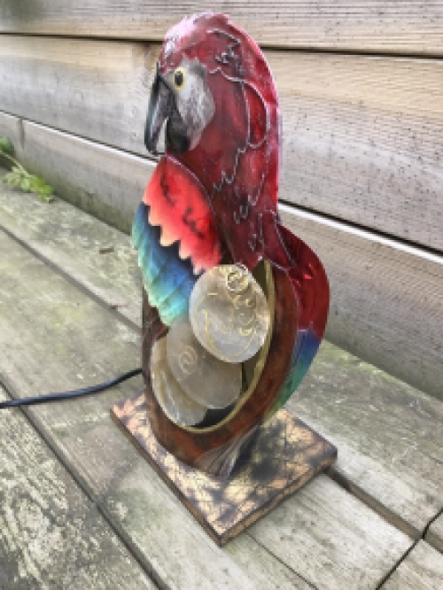 A metal lamp in the shape of a parrot, very beautiful!