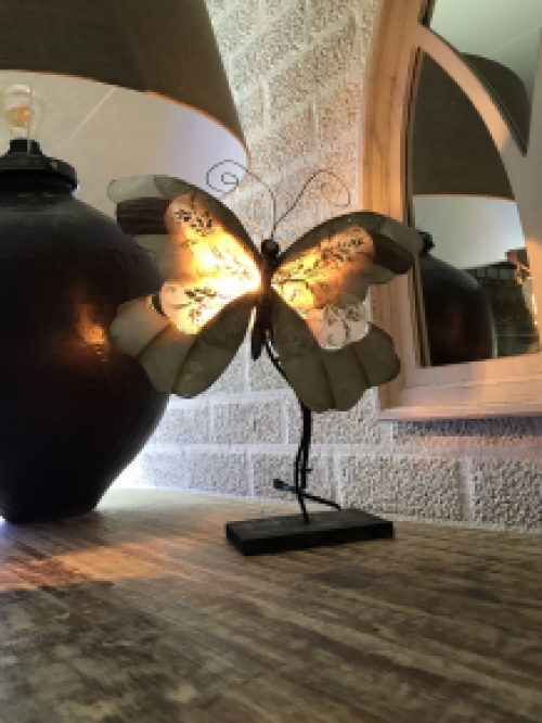 A metal lamp in the shape of a butterfly, very beautiful!