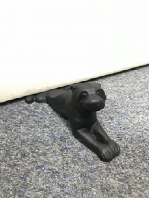 Door stopper in the shape of a dog, nice!