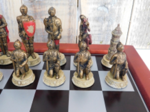 A chess game with the theme: ''MEDIEVAL KNIGHTS'', beautiful chess pieces as medieval knights