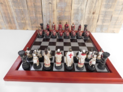 A chess game with the theme: ''MEDIEVAL KNIGHTS'', beautiful chess pieces like medieval knights on a wooden chessboard.