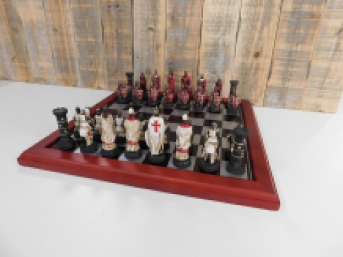 A chess game with the theme: ''MEDIEVAL KNIGHTS'', beautiful chess pieces like medieval knights on a wooden chessboard.