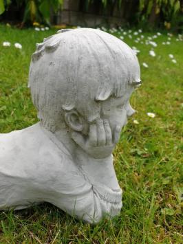 garden statue, lying boy, stone