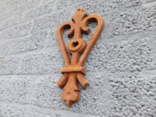 Wall anchor, cast iron, rust, heart shape.