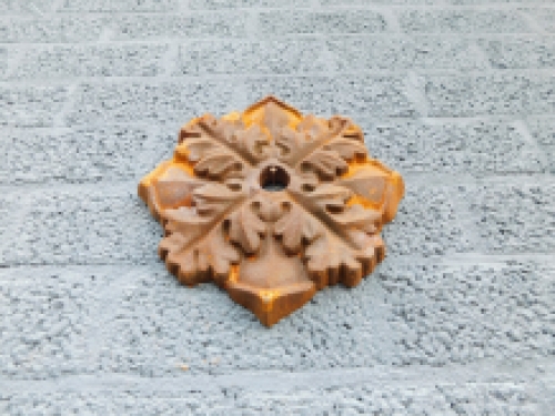 Wall anchor, cast iron, rust brown, leaf shape.