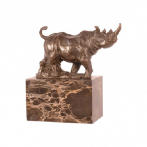 A bronze statue/sculpture of a walking rhino