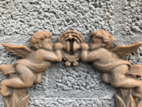 Wall ornament angel scene, cast iron.