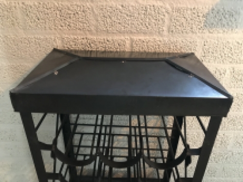 An antique wine rack, metal wine holder for 9 bottles of wine