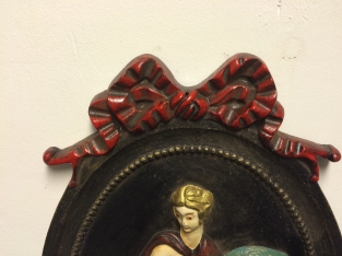 Wall ornament, heavy cast iron, oriental woman in colour.